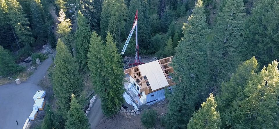 Sage Construction using a Potain Igo MA 21 for a log home construction project