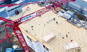 The Potain self-erecting crane makes Cedar Run’s crew more efficient by placing materials precisely where they are needed.