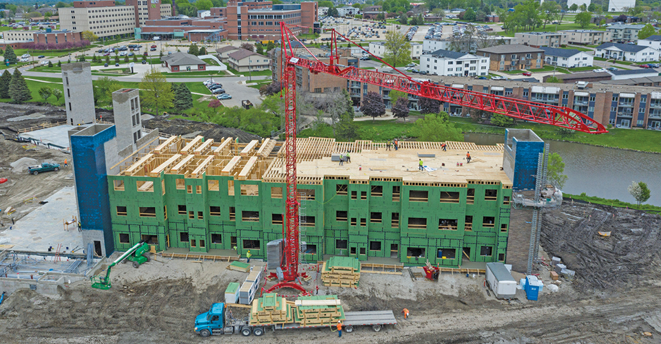 Self erecting tower crane controlling the load